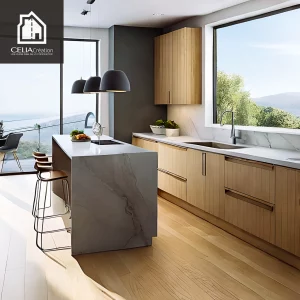 Cuisine lumineuse avec îlot central et grandes baies vitrées réalisée par CELIA Création dans une maison sur-mesure en région sud-ouest